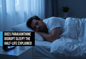 Man sleeping deeply in a premium bedroom at 10:30 PM with a supplement bottle on the nightstand — representing paraxanthine's fast half-life and sleep-protective clearance compared to caffeine.