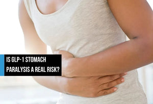 Person holding stomach in discomfort.