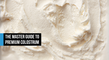 Fine organic grass-fed bovine colostrum powder in soft white tones, resembling premium vanilla whey, suggesting clean cold-processed sourcing and biological purity