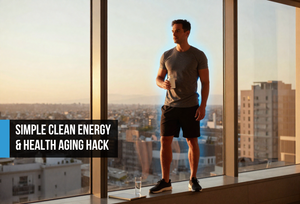 Lean man in his mid-forties standing at a floor-to-ceiling window at golden hour with a supplement bottle, representing Total Longevity Upgrade's cellular energy, cognitive performance, and biological optimization.