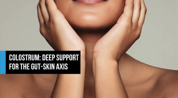 Close-up of a woman with clear glowing skin holding her face in her hands, with text overlay reading Colostrum Deep Support for the Gut-Skin Axis