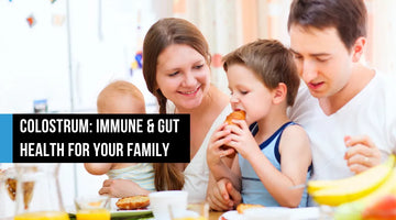 Family of four with two young children eating breakfast together at a table with orange juice and fruit, with text overlay reading Colostrum Immune and Gut Health for Your Family