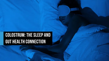 Person sleeping in bed wearing a white eye mask under blue ambient lighting, with text overlay reading Colostrum The Sleep and Gut Health Connection