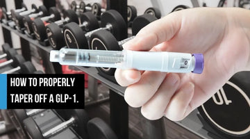 A hand holding a GLP-1 injection pen in front of a gym dumbbell rack, with overlay text 'How to Properly Taper Off a GLP-1.'
