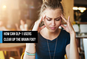 A woman pressing her fingers to her temples with her eyes closed in a cafe, looking mentally foggy, with overlay text reading 'How can GLP-1 users clear up the brain fog?'