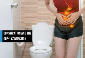 Woman holding abdomen with digestive discomfort.