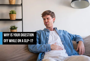 A man sitting on a couch holding his stomach with a pained expression, appearing to have digestive discomfort, with overlay text reading 'Why is your digestion off while on a GLP-1?'