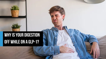 A man sitting on a couch holding his stomach with a pained expression, appearing to have digestive discomfort, with overlay text reading 'Why is your digestion off while on a GLP-1?'