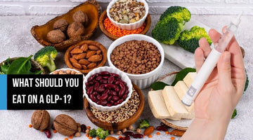 Overhead spread of nutrient-dense foods beside a GLP-1 pen.