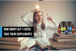 Woman sitting among books beside supplement bottles.