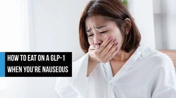 Woman covering mouth due to nausea.