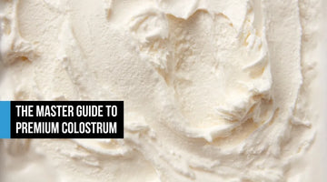 Fine organic grass-fed bovine colostrum powder in soft white tones, resembling premium vanilla whey, suggesting clean cold-processed sourcing and biological purity