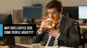 Young professional man at his desk gripping a coffee cup with visible tension and anxiety — illustrating overstimulation and nervous system strain from too much caffeine.